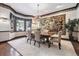 Elegant dining room with a large window, tapestry, and beautiful chandelier at 30544 The Golf Club Point, Evergreen, CO 80439
