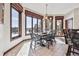 Charming dining room with large windows and a view of the beautiful landscape at 30544 The Golf Club Point, Evergreen, CO 80439
