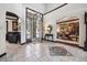 Inviting entryway featuring an open doorway and decorative tile flooring, with views into the dining room at 30544 The Golf Club Point, Evergreen, CO 80439