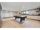 Basement game room with a pool table and nice lighting at 30544 The Golf Club Point, Evergreen, CO 80439