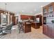 Bright kitchen features granite countertops, a large island, stainless steel appliances, and custom cabinetry at 30544 The Golf Club Point, Evergreen, CO 80439