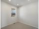 Clean and bright bedroom with neutral carpet and a window with blind coverings for added privacy at 6083 Sugarloaf St, Brighton, CO 80601