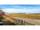 Overlooking a sprawling lawn with mountain views in the distance, this property offers a serene escape at 20341 E 48Th Pl, Denver, CO 80249