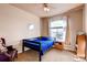 Cozy bedroom featuring a comfortable bed, a window view, and a side table at 20341 E 48Th Pl, Denver, CO 80249