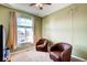 Inviting bedroom featuring comfortable chairs, and a window view at 20341 E 48Th Pl, Denver, CO 80249