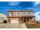 Charming two-story house with a two car garage and a well-maintained lawn at 20341 E 48Th Pl, Denver, CO 80249