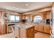 Modern kitchen with stainless steel appliances, granite countertops, and wood cabinets at 20341 E 48Th Pl, Denver, CO 80249