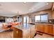 Open concept kitchen featuring an island, stainless appliances, and breakfast area at 20341 E 48Th Pl, Denver, CO 80249
