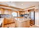 Bright kitchen with a center island, stainless appliances, and plenty of cabinet space at 20341 E 48Th Pl, Denver, CO 80249