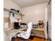 Functional home office with built-in shelves, a spacious desk, and plenty of natural light at 20341 E 48Th Pl, Denver, CO 80249