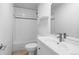 Bathroom with a tub and sink with a large mirror at 3319 Newton St, Denver, CO 80211
