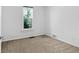 Neutral bedroom with a bright window at 3319 Newton St, Denver, CO 80211
