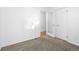Carpeted bedroom featuring closet and doorway at 3319 Newton St, Denver, CO 80211