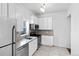 Renovated kitchen with stainless steel appliances and bright cabinets at 3319 Newton St, Denver, CO 80211