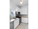 Updated kitchen with stainless appliances, modern cabinets, and ample sunlight at 3319 Newton St, Denver, CO 80211