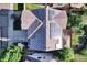 Aerial view of a home's roof featuring solar panels on a sunny day at 8489 S Quay St, Littleton, CO 80128