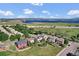 Aerial view of community homes with a lake and mountains in the background on a sunny day at 8489 S Quay St, Littleton, CO 80128