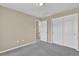 A view of the bedroom with neutral walls and carpet floors at 8489 S Quay St, Littleton, CO 80128
