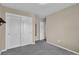 A view of the bedroom with neutral walls and carpet floors at 8489 S Quay St, Littleton, CO 80128