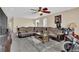 Living Room features ceiling fan and plush sofa with area rug at 8489 S Quay St, Littleton, CO 80128