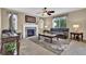 Comfortable living room with a fireplace, plush seating, and natural light at 8489 S Quay St, Littleton, CO 80128