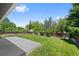 Grassy backyard featuring a spacious lawn and mature trees, perfect for outdoor activities at 2646 S Pagosa Way, Aurora, CO 80013