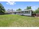 Expansive backyard with lush green grass and a patio, perfect for outdoor relaxation and entertainment at 2646 S Pagosa Way, Aurora, CO 80013