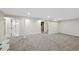Spacious basement featuring neutral carpeting and access to the bathroom at 2646 S Pagosa Way, Aurora, CO 80013