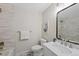 Modern bathroom with stylish fixtures, a sleek vanity, and a tiled shower at 2646 S Pagosa Way, Aurora, CO 80013