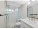 Bathroom with a glass-enclosed shower, modern vanity, and stylish tile flooring at 2646 S Pagosa Way, Aurora, CO 80013