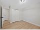 A bedroom with a double door closet and light wood flooring at 2646 S Pagosa Way, Aurora, CO 80013