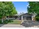 Charming single-story home with a well-maintained lawn, mature trees, and a two-car garage at 2646 S Pagosa Way, Aurora, CO 80013