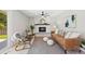 Comfortable living room with a fireplace, stylish furnishings, and lots of natural light at 2646 S Pagosa Way, Aurora, CO 80013