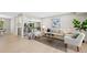 Bright living room featuring neutral furniture, light wood floors, and a stylish area rug at 2646 S Pagosa Way, Aurora, CO 80013