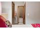 Bathroom visible from bedroom showcasing a tub and tiled shower at 13313 Cherry Cir, Thornton, CO 80241