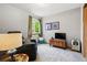 Cozy bedroom with natural light, comfortable seating, and unique decor at 13313 Cherry Cir, Thornton, CO 80241