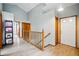 Bright foyer featuring wood floors, an open staircase, and a white front door at 13313 Cherry Cir, Thornton, CO 80241