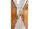 Hallway featuring natural lighting and bathroom at end of hall at 13313 Cherry Cir, Thornton, CO 80241