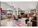 Bright living room featuring a fireplace, large windows, and stylish decor at 13313 Cherry Cir, Thornton, CO 80241