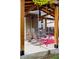 Backyard patio features wooden pergola, colorful seating, overhead lighting, and ceiling fan at 13313 Cherry Cir, Thornton, CO 80241