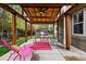 Outdoor patio features wooden pergola, ceiling fan, and colorful seating for entertaining at 13313 Cherry Cir, Thornton, CO 80241