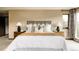 Bedroom features a stylish iron headboard, and well-lit nightstands creating a cozy ambiance at 7290 Timber Trail Rd, Evergreen, CO 80439