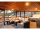Spacious deck with fire table, jacuzzi, and outdoor seating area at 7290 Timber Trail Rd, Evergreen, CO 80439