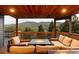 Expansive deck with fire table and mountain views at 7290 Timber Trail Rd, Evergreen, CO 80439
