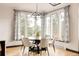 Elegant dining area with mountain views and stylish lighting fixture at 7290 Timber Trail Rd, Evergreen, CO 80439