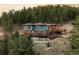 Stunning mountain home with expansive decks and beautiful forest surroundings at 7290 Timber Trail Rd, Evergreen, CO 80439