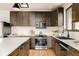 Spacious kitchen features a modern design, stainless steel appliances and ample counter space at 7290 Timber Trail Rd, Evergreen, CO 80439