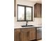 Close up of modern kitchen details with dark cabinets and an undermount sink at 7290 Timber Trail Rd, Evergreen, CO 80439