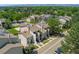 This aerial view captures a multi-Gathering residence with light gray exterior paint in a lush, green neighborhood at 6011 Yarrow St # I, Arvada, CO 80004