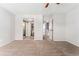 Spacious bedroom with multiple closets, doorways, and neutral carpet at 6011 Yarrow St # I, Arvada, CO 80004
